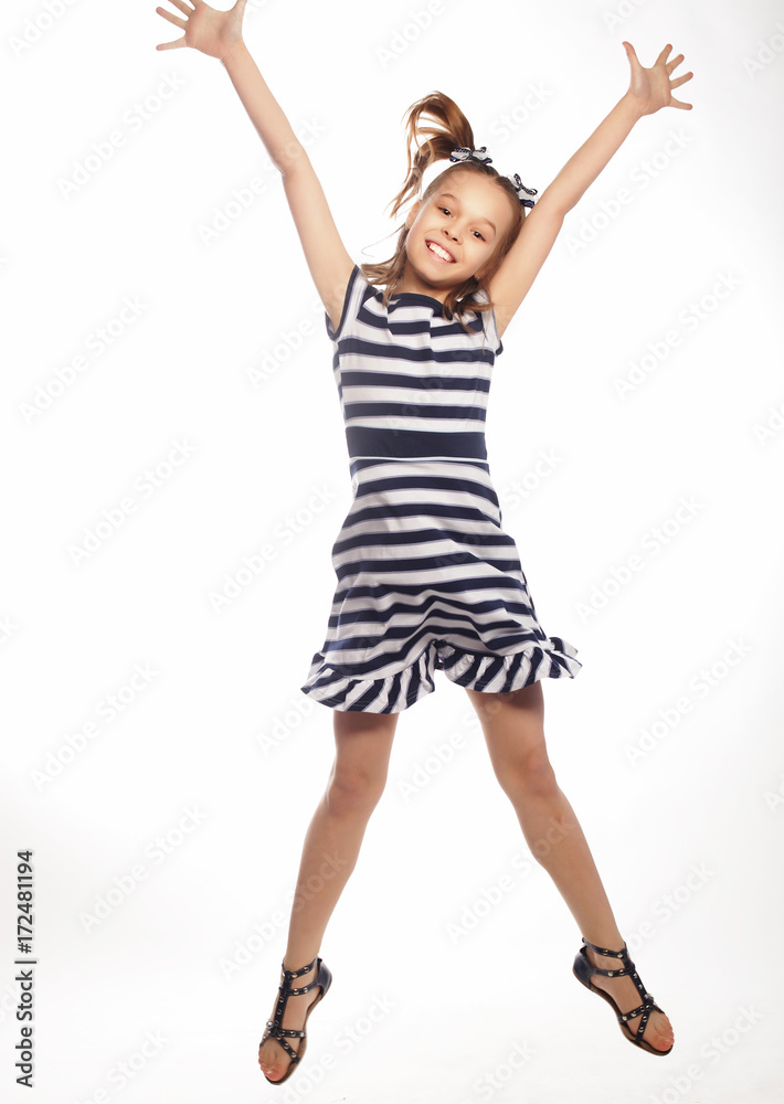 happy girl jumps on a white background