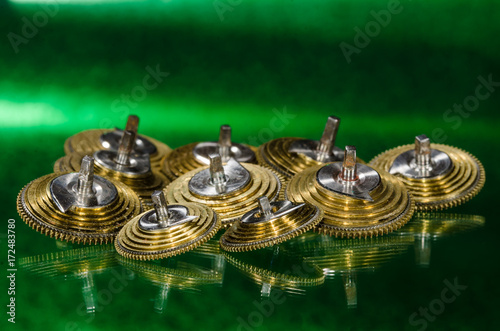 Watch Repair: Vintage Pocket Watch Fusee Cones Resting on a Green Surface