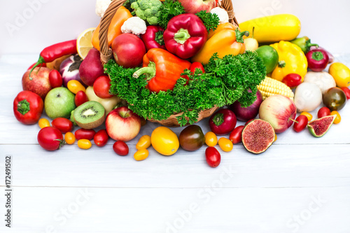 Wicker basket full of organic fruit and vegetables.