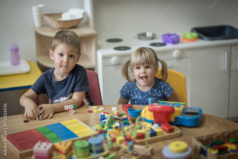 Pre school kids are playing with montessori toys Pre school kids are playing with montessori toys