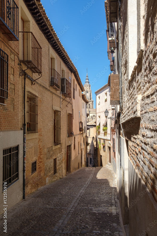 Street with old buildings on the medieval city of Toledo in Spain