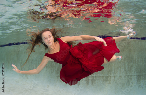 Attractive young women modeling various outfits at a pool.