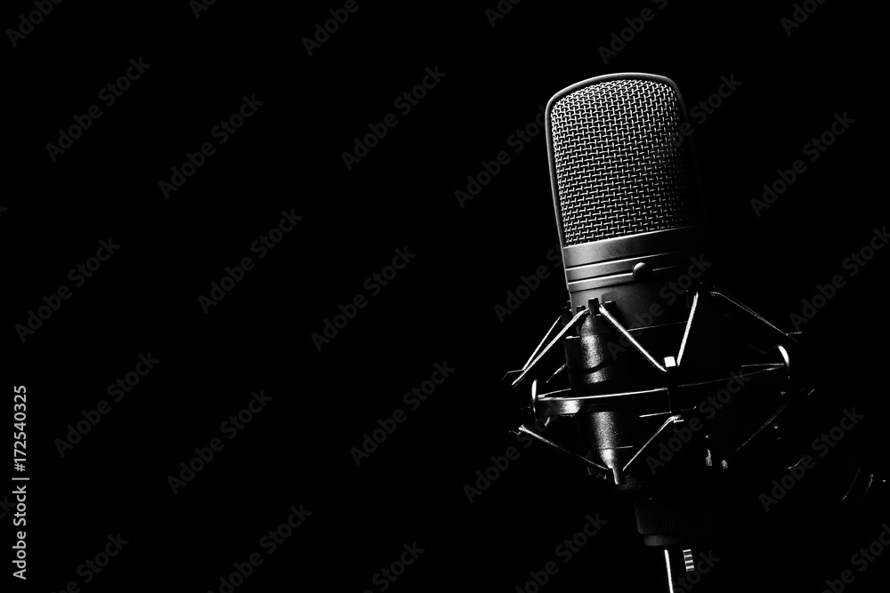 studio condenser microphone, isolated on black. copy space on left - obrazy, fototapety, plakaty 