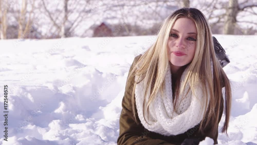 Young woman laughing in the snow Young woman laughing in the snow