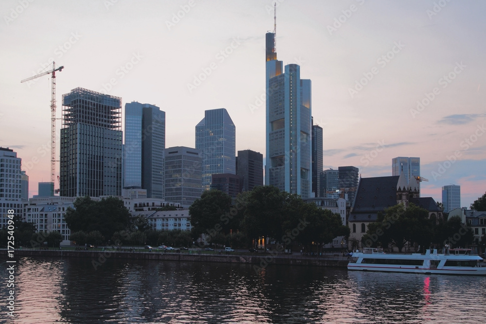 River, embankment and modern city. Frankfurt am Main, Germany