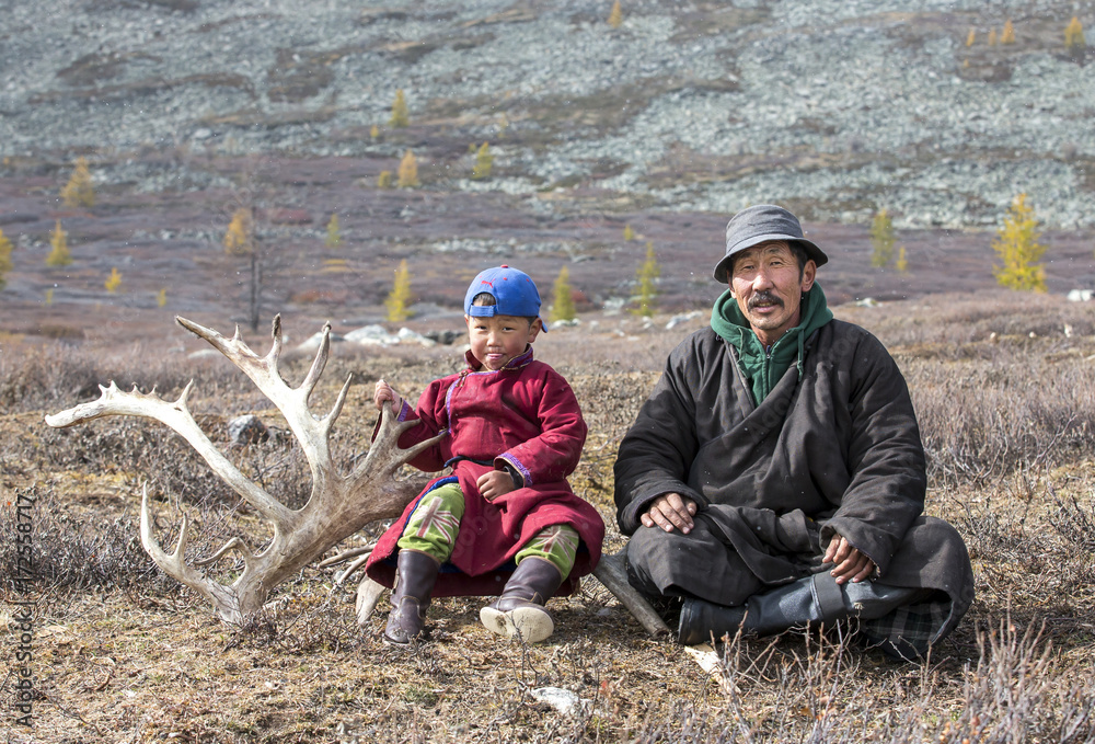tsaatan nomadic boy and his grandfather in a traditional deels resting tsaatan nomadic boy and his grandfather in a traditional deels resting