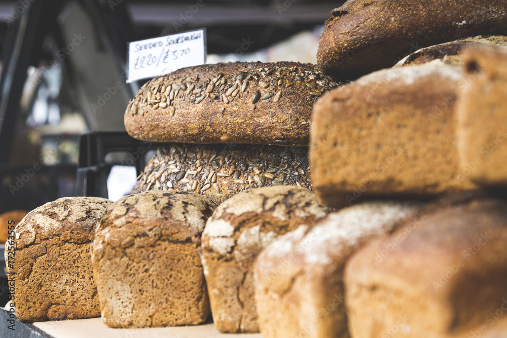 Closeup of Sourdough and Rye Bread Loaves in Street Market Closeup of Sourdough and Rye Bread Loaves in Street Market