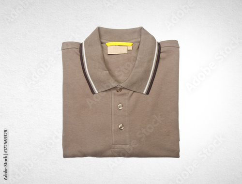 shirt or mens folded polo shirt on background.