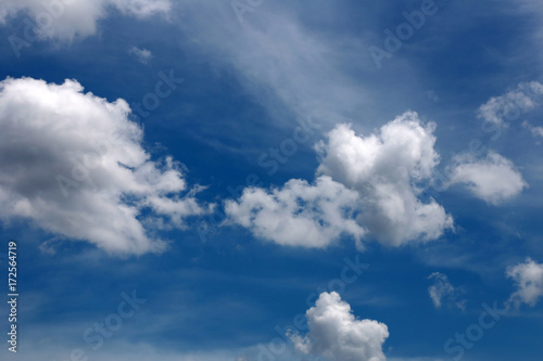 White clouds on blue sky for background.