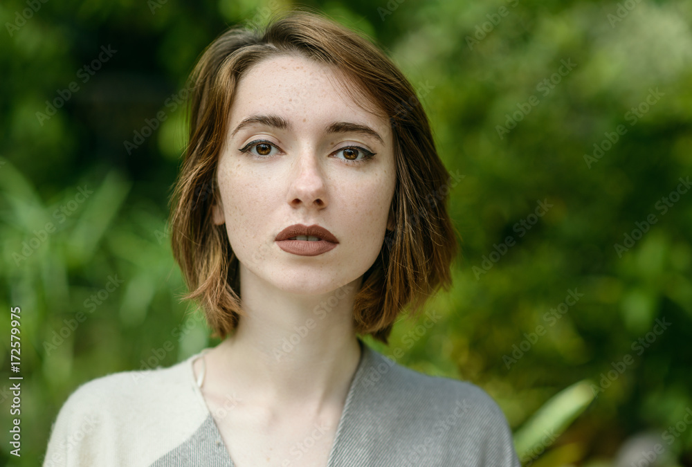 Portrait of beautiful woman with freckles.