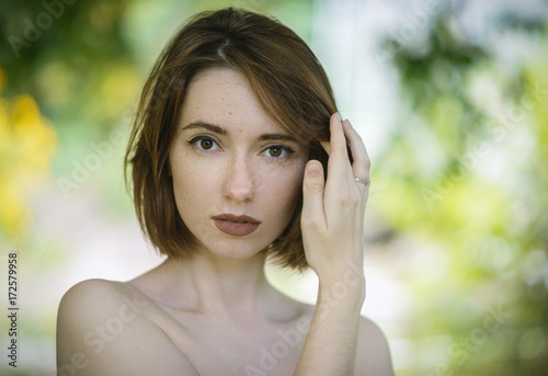 Portrait of beautiful woman with freckles.