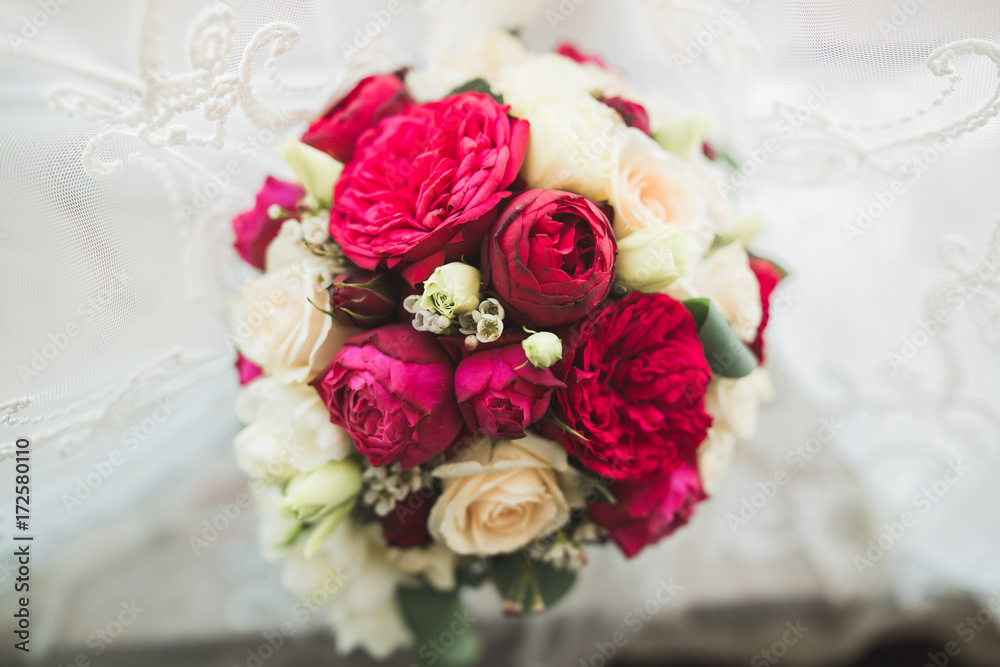 Beautiful wedding bouquet with different flowers, roses