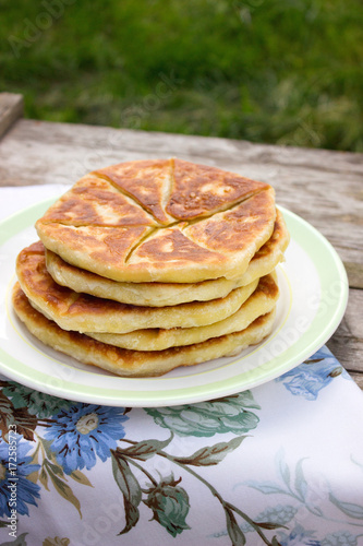 Traditional homemade Romanian and Moldovan pies - Placinta. Rustic style, selective focus.