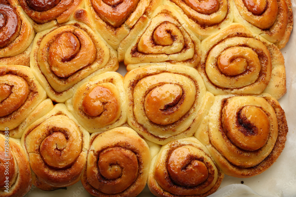 Fototapeta premium Sweet cinnamon buns with honey