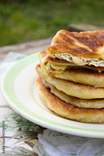 Traditional homemade Romanian and Moldovan pies - Placinta. Rustic style, selective focus.