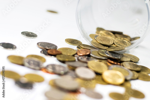Golden coins in a glass jar. Concept of money saving and financial. Selective focus.