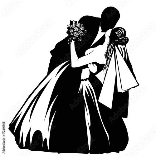 Silhouettes of kissing bride and groom