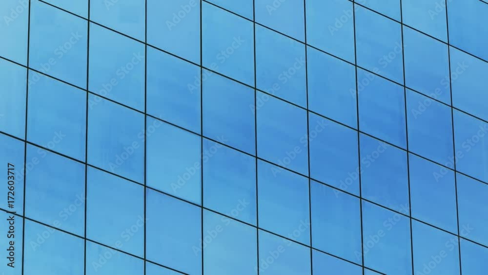 Sky time lapse reflection from modern office building. Sky time lapse reflection from modern office building.