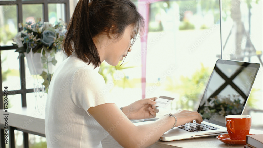 Young asian woman used laptop shopping online Young asian woman used laptop shopping online