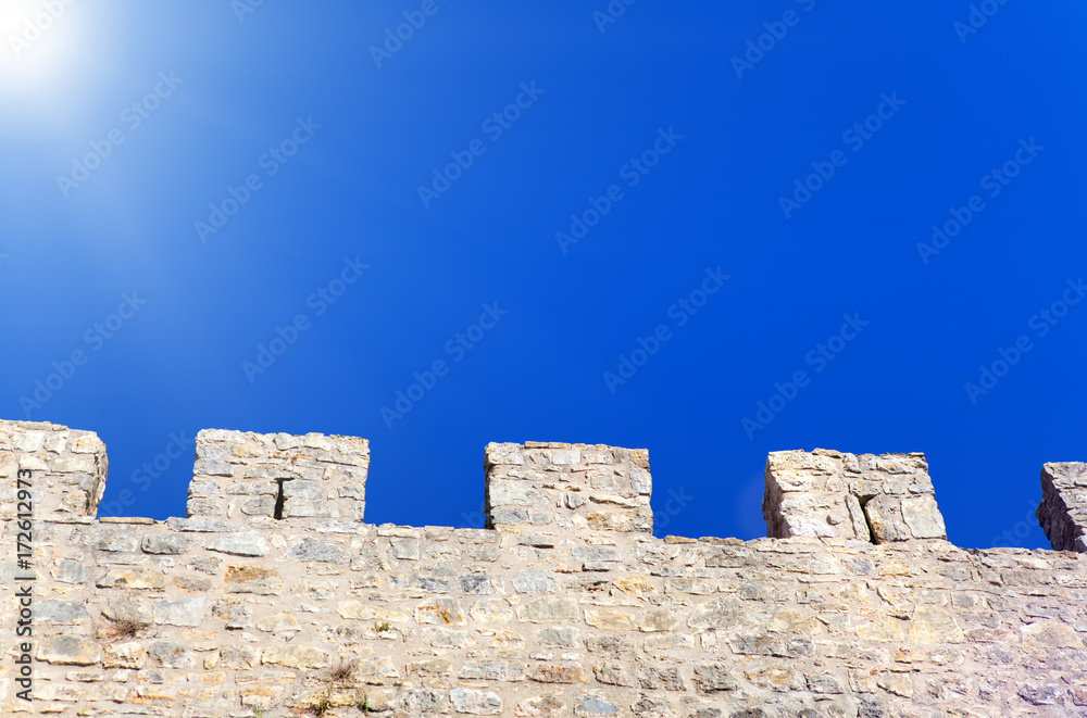 Stone wall and blue sky , background
