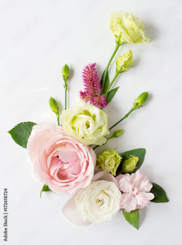 Flowers composition with place for text. Frame made of fresh flowers. Flat lay, top view
