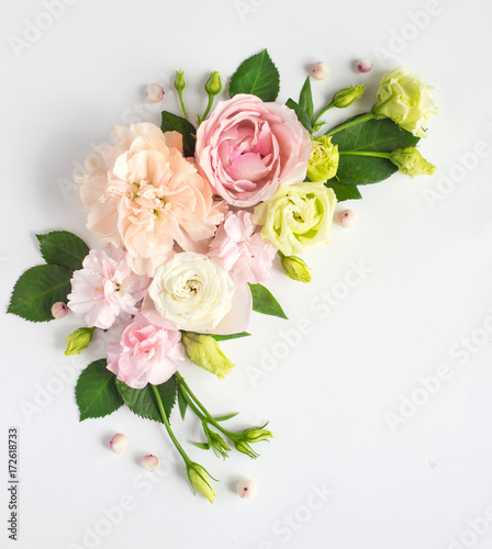 Flowers composition with place for text. Frame made of fresh flowers. Flat lay, top view