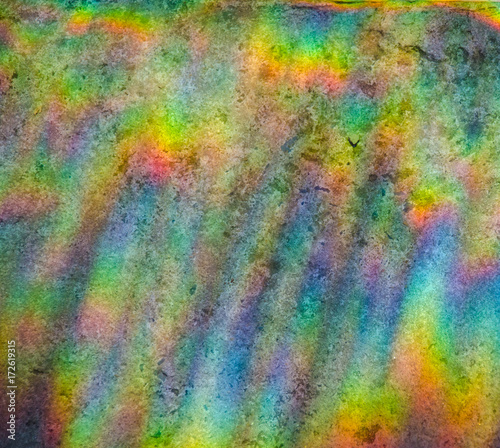 Beautiful abstract multicolored rainbow background (refraction of sun light on a stone background)