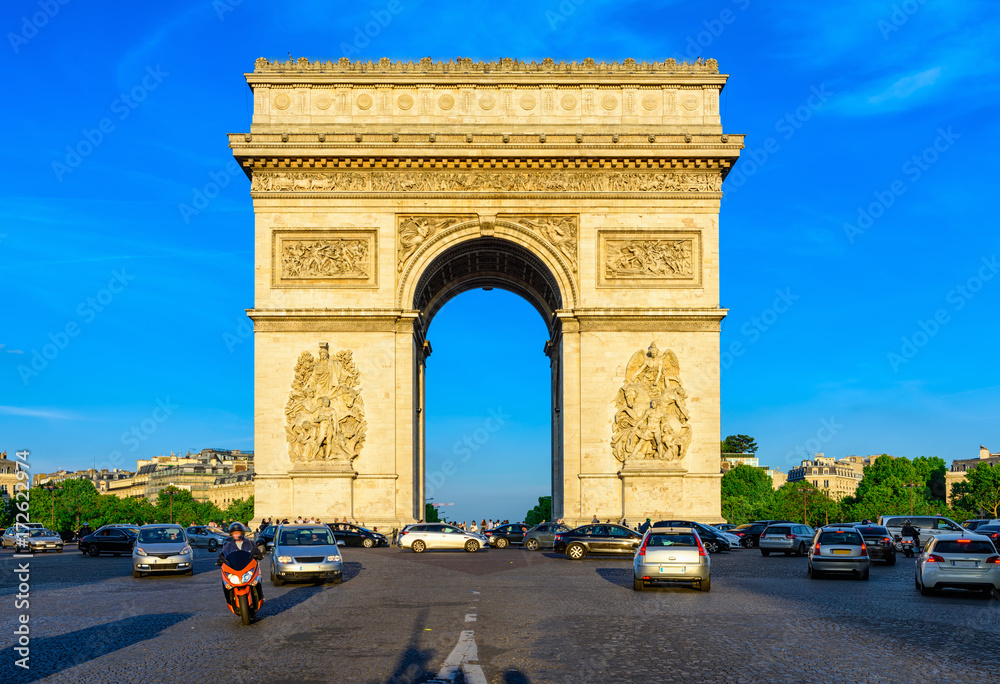 Paris Arc de Triomphe (Triumphal Arch) in Chaps Elysees at sunset, Paris, France.