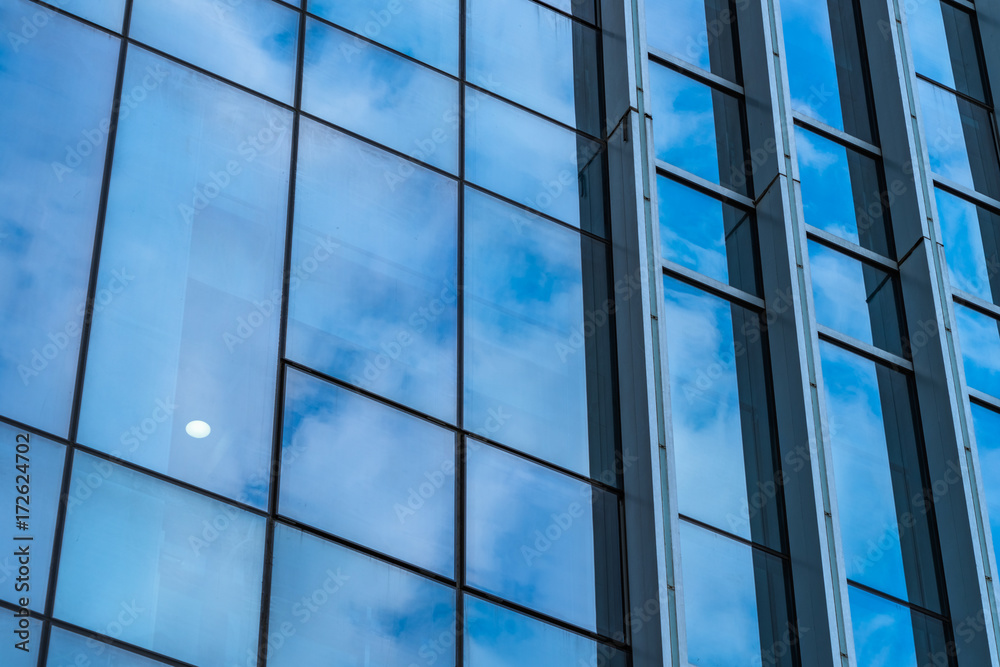 Clouds Reflected in Windows of Modern Office Building. Clouds Reflected in Windows of Modern Office Building.