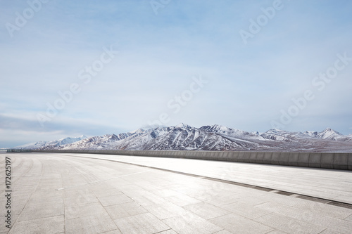 empty marble floor with beautiful snow mountains