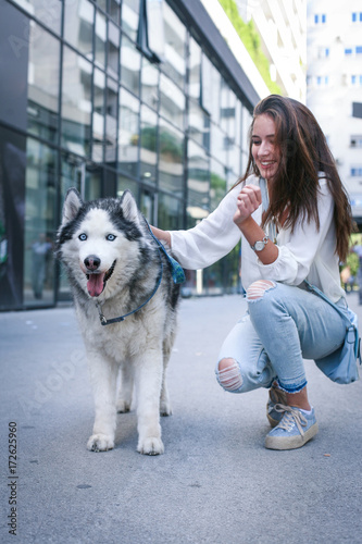 Young woman with dog In city. Teenager girl  with her dog.