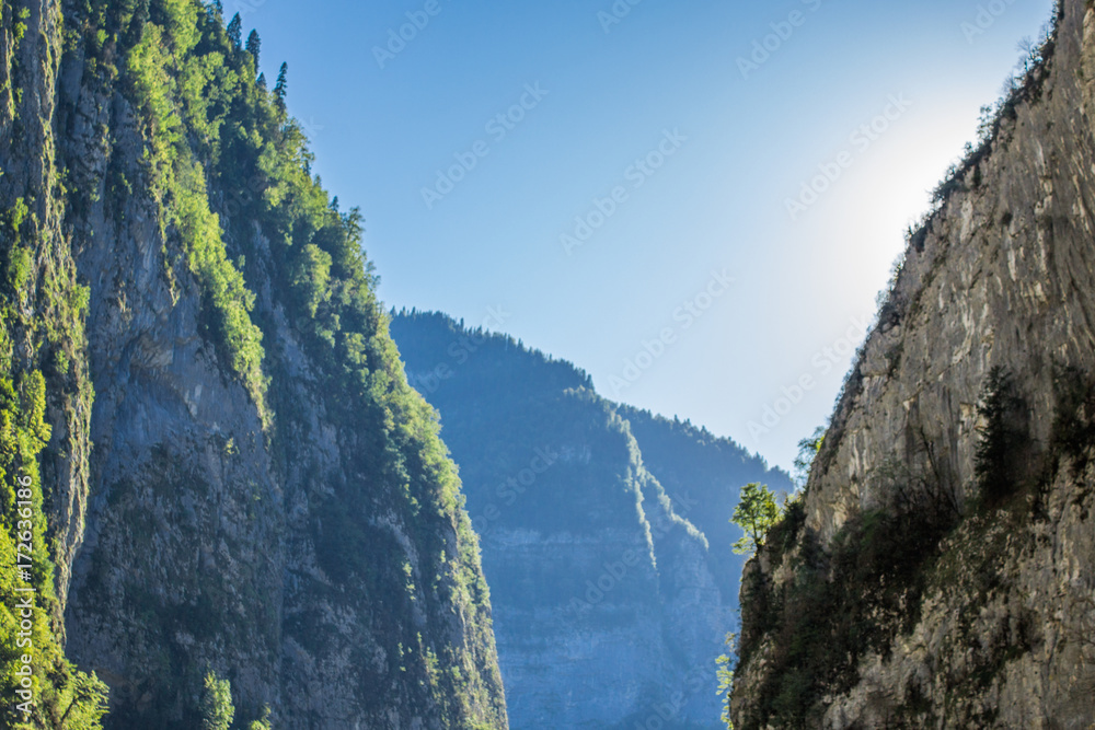 The sun shines through the gorge in the mountains The sun shines through the gorge in the mountains