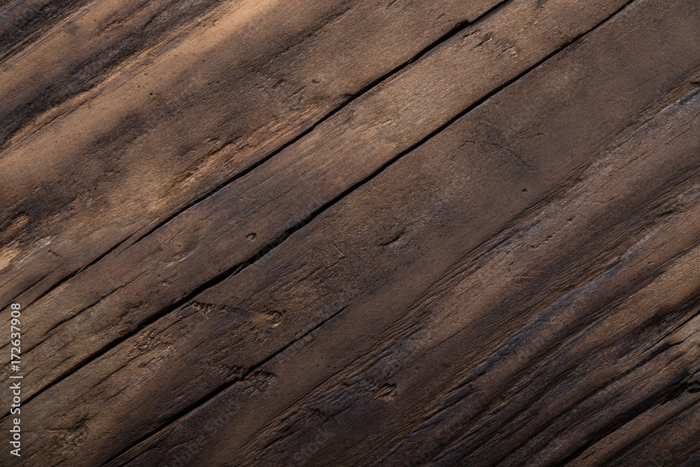 Wooden burned rustic texture for background. Rough weathered wooden board Wooden burned rustic texture for background. Rough weathered wooden board