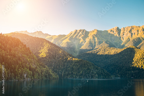 Beautiful lake ritsa in Abkhazia. Landscape of the mountains of the forest and the lake photo