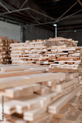 Stack of wood in warehouse in a furniture manufacture production.