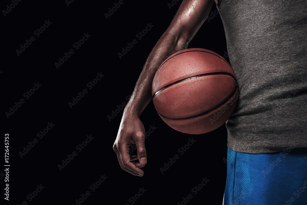 The hands of a basketball player with ball The hands of a basketball player with ball