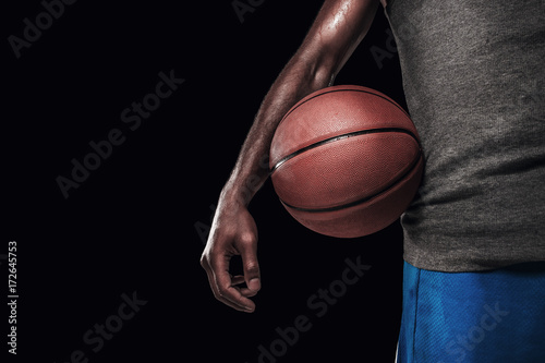 The hands of a basketball player with ball © master1305