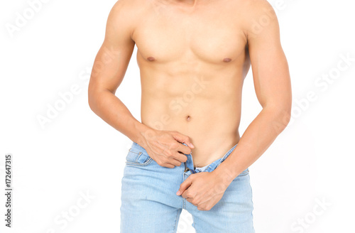 Bild auf Leinwand Close up upper part of sexy young Asian muscular man unzipping jean trousers iso