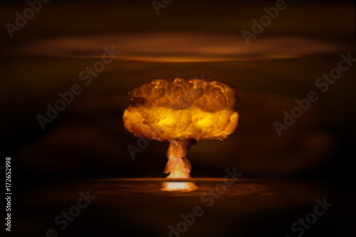 Fotografie Atomic bomb realistic explosion, orange color with smoke on black background