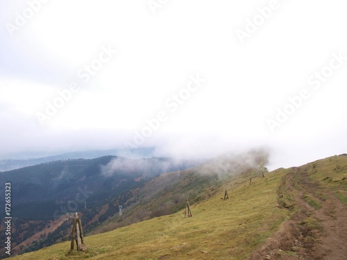 Top of the Ganekogorta mountain range with fog in autumn in Biscay, Basque Country/Euskadi photo