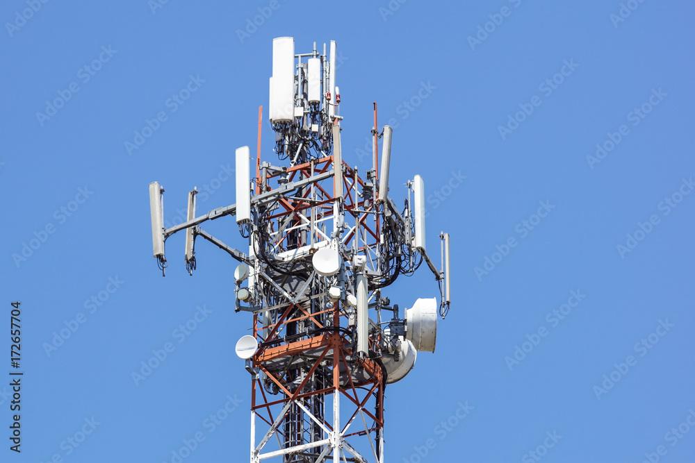 Antenna tower,antenna tower building with the blue sky.Close-up of the antenna building with the sky background. Antenna tower,antenna tower building with the blue sky.Close-up of the antenna building with the sky background.