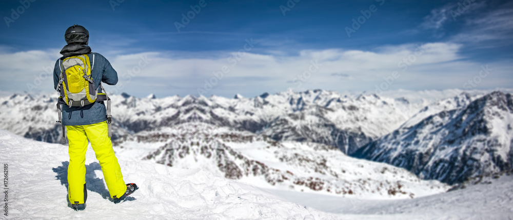 skier and mountains 