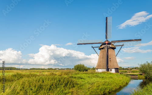 Historical mill in Dutch polder landscape