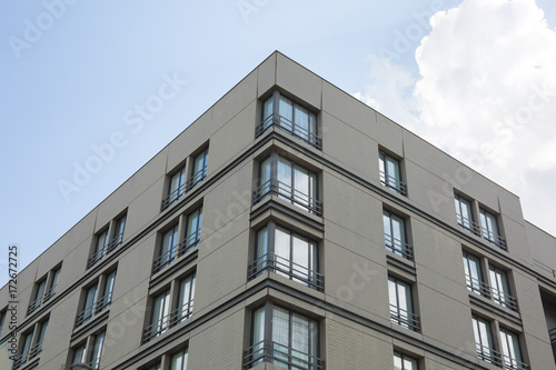 Apartment block flat blocks building blue sky background