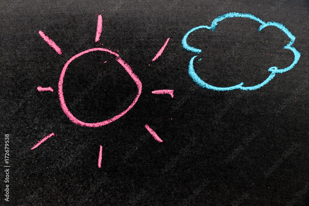 Chalk drawing as pink sun and blue cloud on black board background