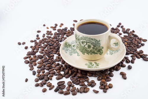 Concept roasted coffee beans and hot coffee with isolated white background