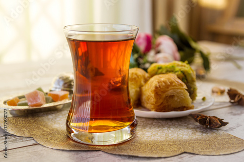 traditional glass of Turkish tea with baklava