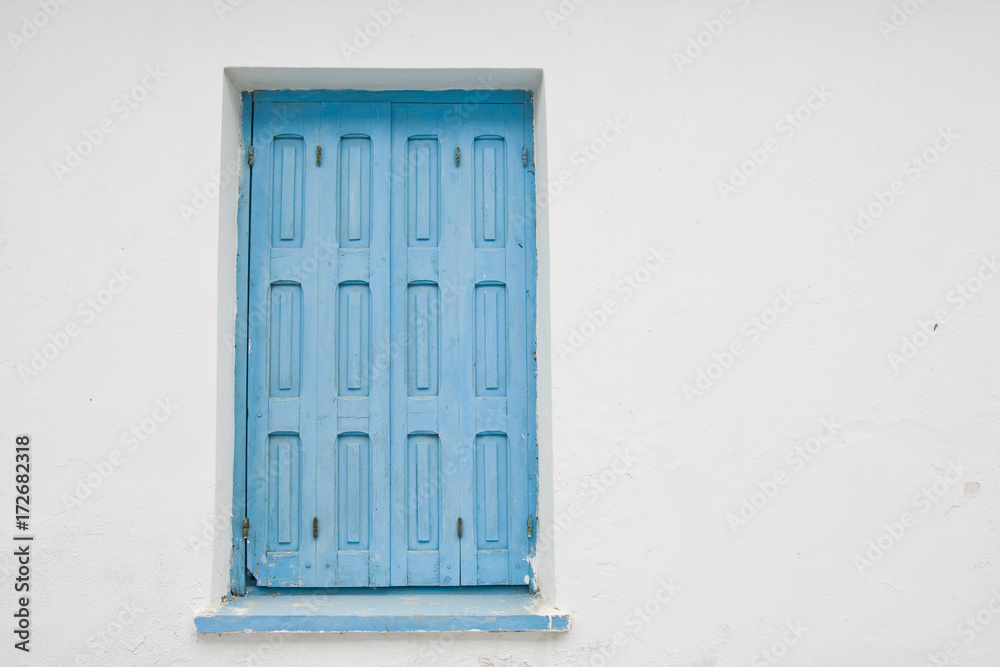 old blue painted wooden window