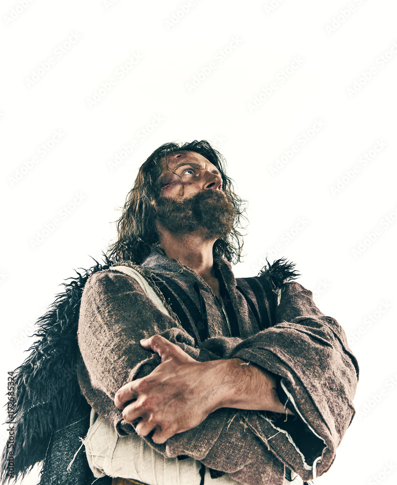 Portrait of a brutal bald-headed viking in a battle mail posing against a white background. Portrait of a brutal bald-headed viking in a battle mail posing against a white background.
