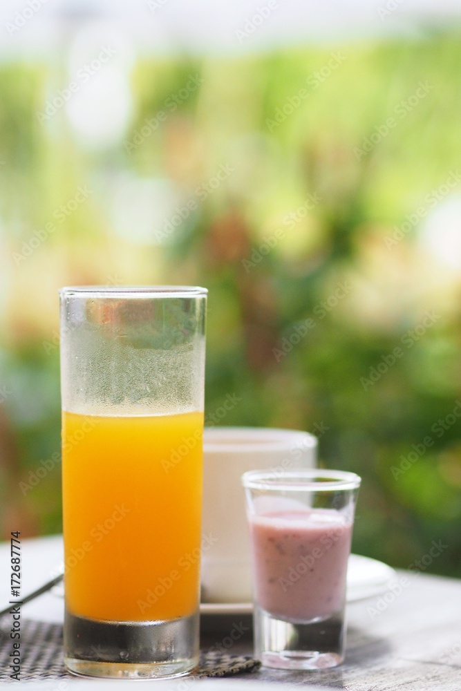 Orange juice over nature leaf background. Orange juice over nature leaf background.